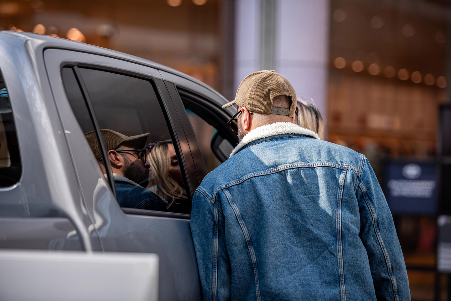 A fleet customer examining a pickup at a showroom event